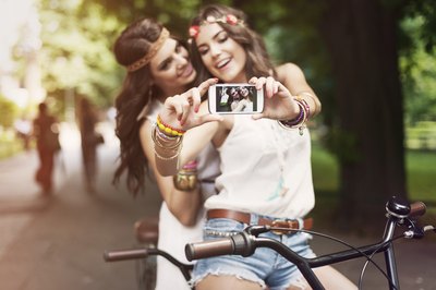 Girls taking photo of themselves with hippie look