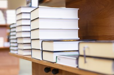 Books on a shelf in a bookstore