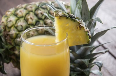 A glass of pineapple juice.