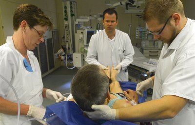 Doctor and staff with patient