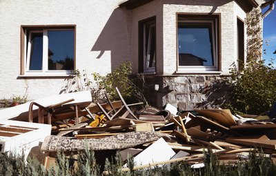 Real estate agents use waste removal services to clean up around houses.