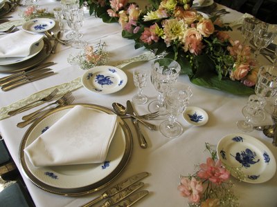 a set table of matching antique dinner-ware