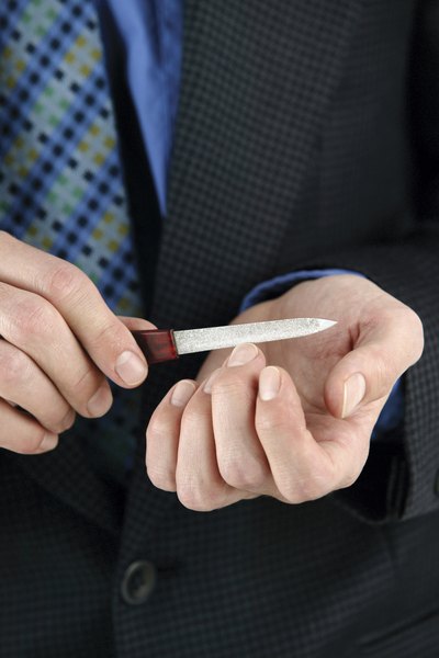 Use a metal nail file.