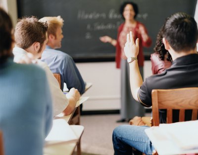 Man raising hand in classroom