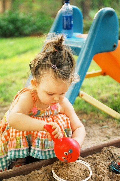 Keep your child's sandbox clean with a protective animal-proof cover.