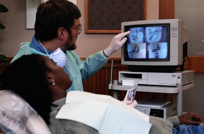 Dentist explaining diagnostic images.