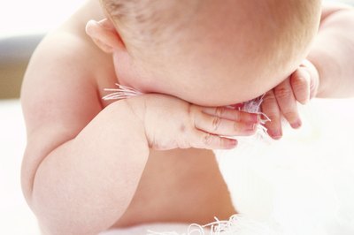 Baby rubbing eyes