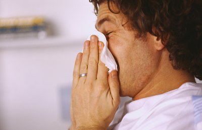 Man blowing nose