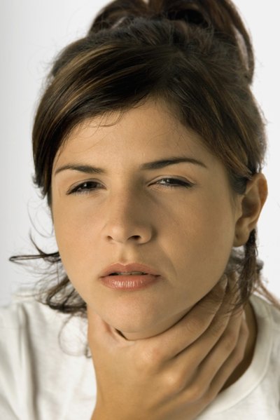 Woman with sore throat
