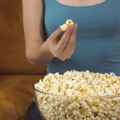 Woman eating popcorn