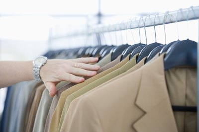 A suit coat is worn with a complementary tie.