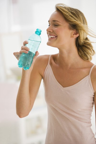 Woman drinking a bottle of water