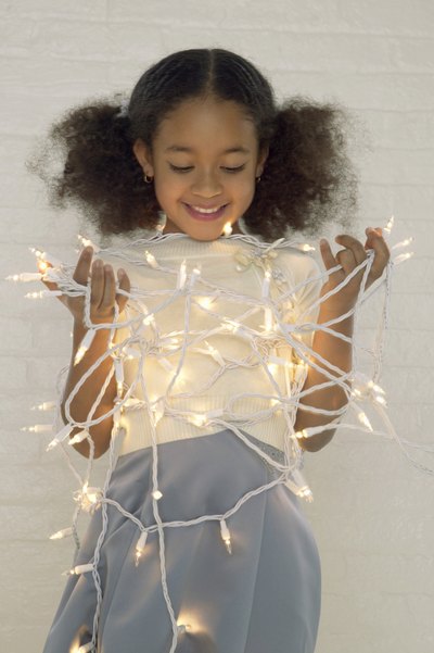 Girl holding lights