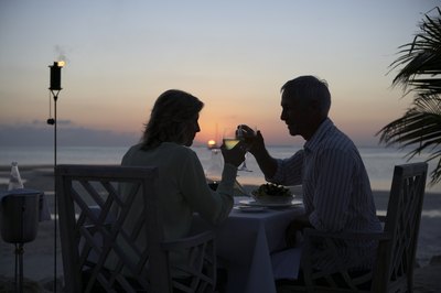 Couple toast at sunset at Little Torch Key resort terrace