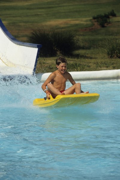 Young boy riding raft in waterpark in Myrtle Beach