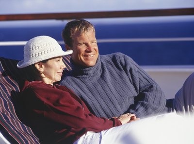 A couple enjoys the view in lounge chairs.