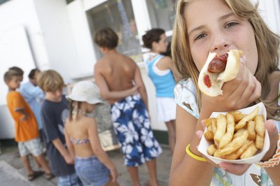 Hamburgers and hot dogs are a big hit with children at the Little League ball park.