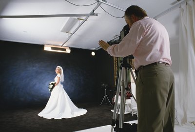 A bride-to-be poses in the wedding photographer's studio.
