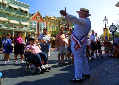 Guest listen to actor on Main Street USA at Disney's Magic Kingdom