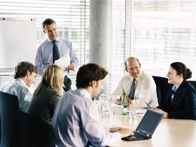boss updating employees with status of company