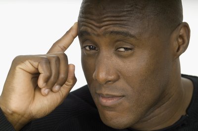 man pointing to brain