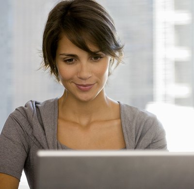 Woman smiling on laptop