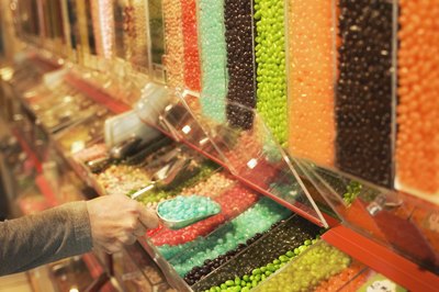 man picking out blue candy