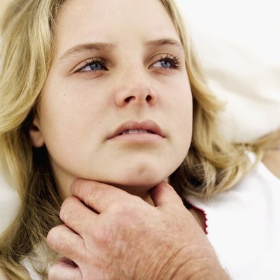 Because the lymph nodes in the neck are swollen, you may experience trouble breathing, coughing, or even chest pains.