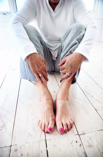 Elderly woman with bare feet