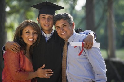 Teen with parents at graduation