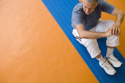 Perform a lower body workout consisting of squats, calf raises, leg extensions, and bicep curls.