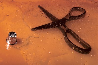 Use craft scissors to scallop the edges of paper.