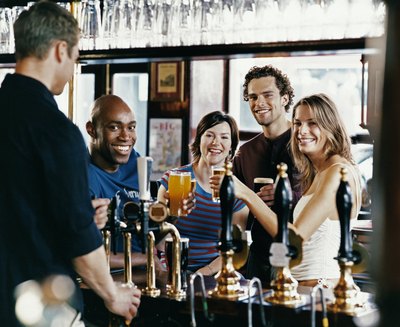 Group of friends drinking at a bar.