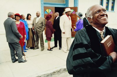 Pastor of church holding bible