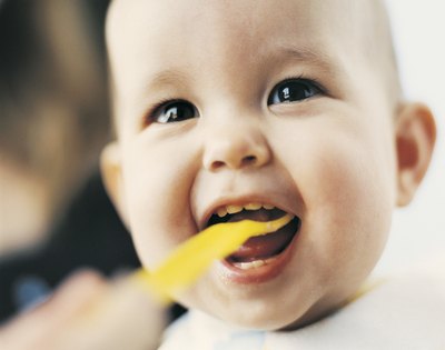 Baby eating yogurt