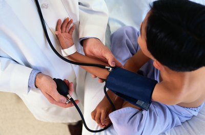 child having his blood pressure taken