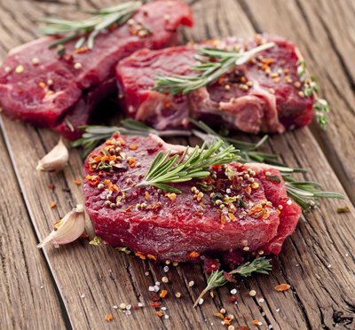 Raw filet mignon with herbs and spices