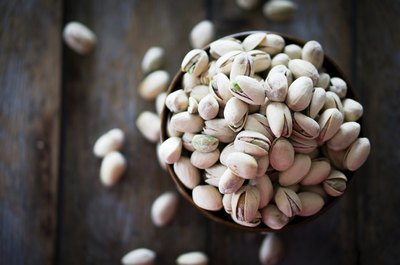 Small bowl of pistachio nuts.