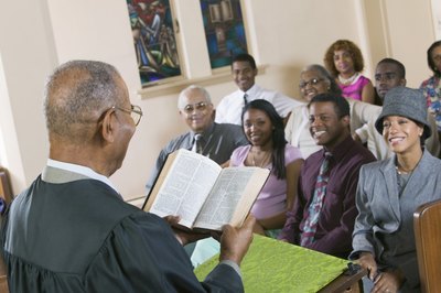 Paster giving sermon in church.