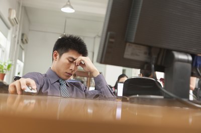 Stressed businessman at work