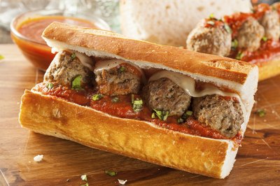 Homemade meatball and cheese sandwich on counter