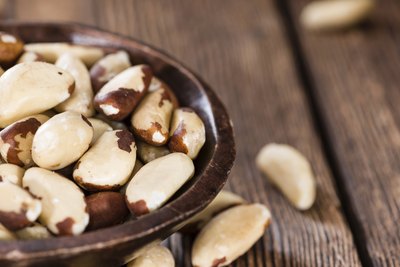 A bowl filled with Brazil nuts.