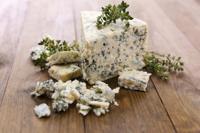 Crumbled blue cheese on table
