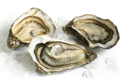 Oysters can be eaten raw or cooked to increase zinc levels.