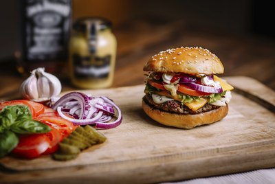 Cheeseburger on cutting board