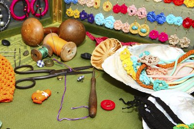 Homemade jewelry tools and materials with assorted fabrics
