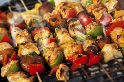 Skewers cooking on a barbecue grill