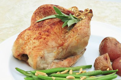 Cornish hen with green beans and potatoes.