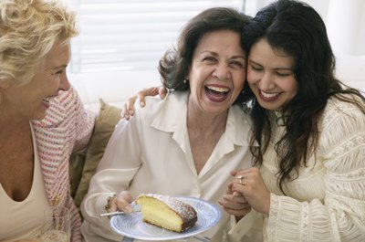 Woman laughing with cake