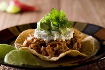 A tostada with shredded pork.